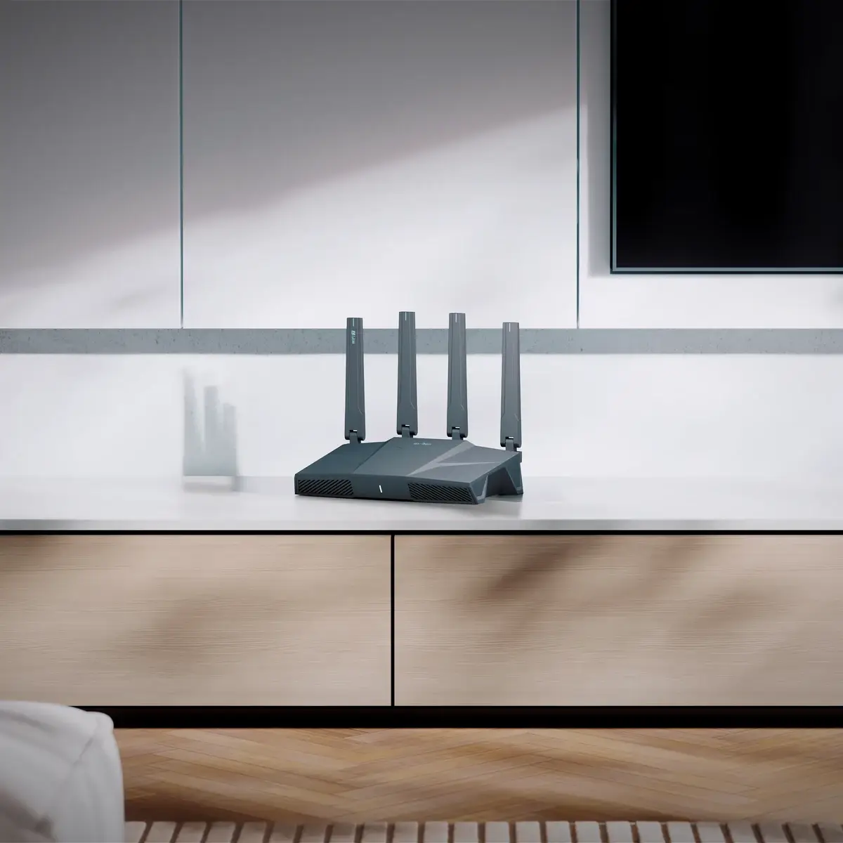 GL.iNet Flint 3e GL-BE6500 in a living room on a media console